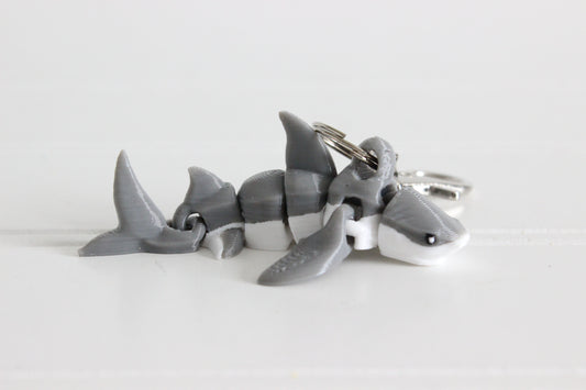 3D-printed gray-and-white great white shark keychain with a silver swivel quick-clip on a white background.